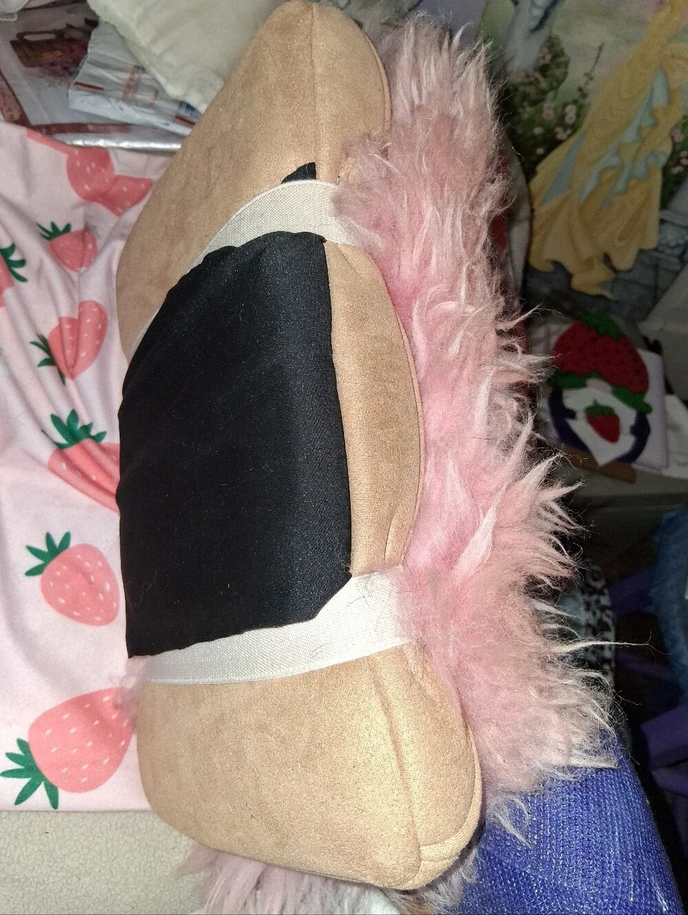 Pink Fuzzy Pilliw Attached To A Swade  Pillow